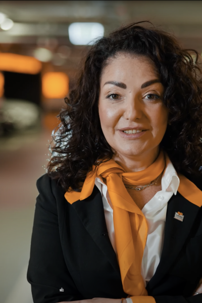 A Rental Sales Agent in her uniform posing for the camera.