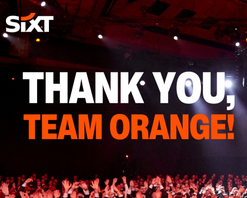 A big group of people wearing SIXT uniforms, laughing and throwing their hands in the air. The image features the phrase: "Thank you, Team Orange!".