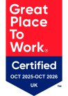 The image shows a badge certifying a company as a "Great Place to Work" in the UK for the period from October 2025 to October 2026.